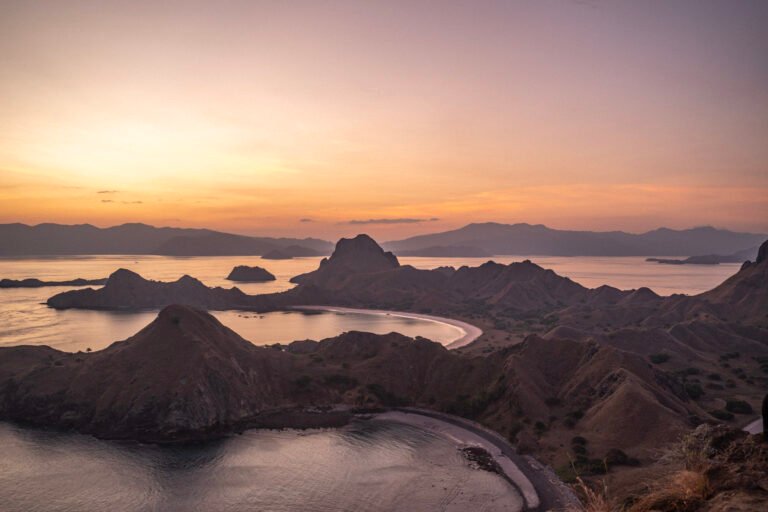 padar island komodo national park, padar island summit hike, padar island viewpoint, iconic padar island landscape, padar island trekking guide, padar island travel tips, multi colored beaches padar island, island hopping padar island, pink beach near padar island, best view in komodo national park, komodo national park tourism statistics, komodo island visitor numbers 2026, indonesia tourism growth komodo, komodo dragons in the wild, see komodo dragon habitat
